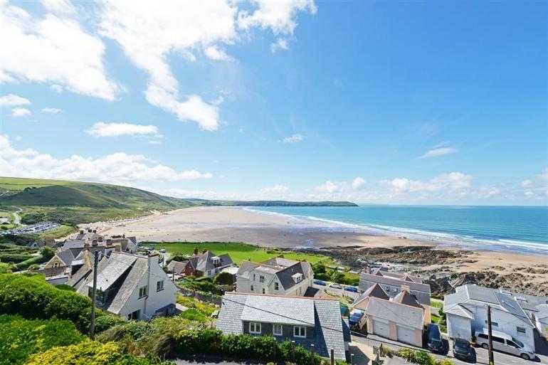 Collection of cottages by Woolacombe beach with sea views and beach access.
