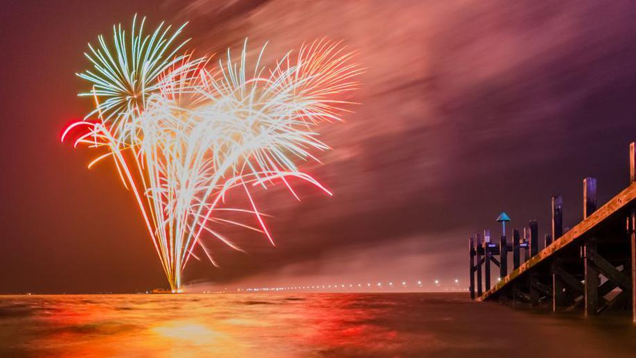 Fireworks at New Years Eve on the beach in the UK