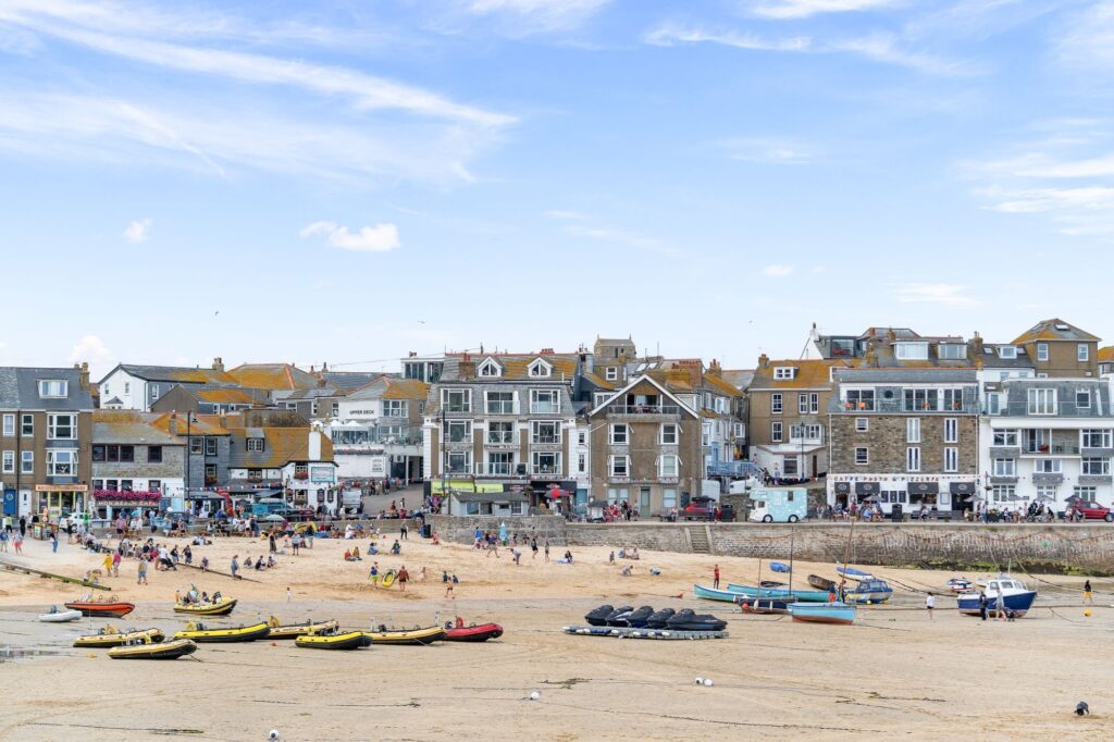 St Ives harbour with tide out and boats