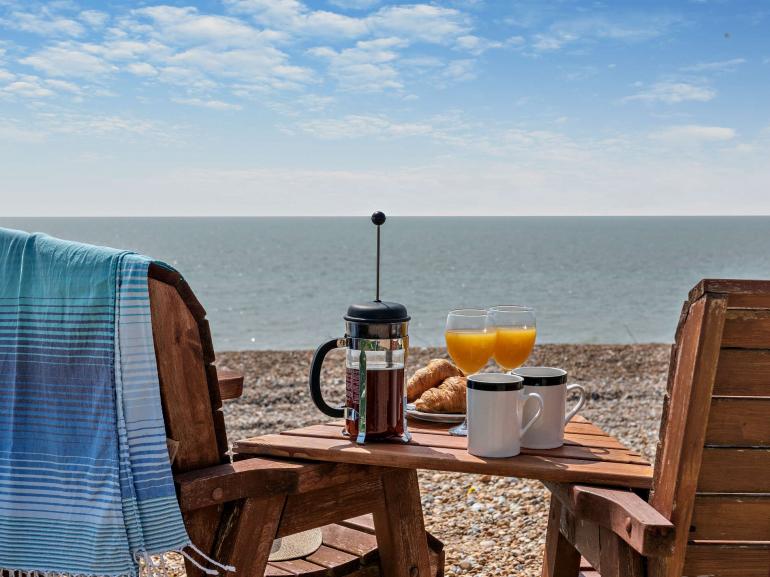 Outdoor furniture at the end of the garden overlooking the seafront