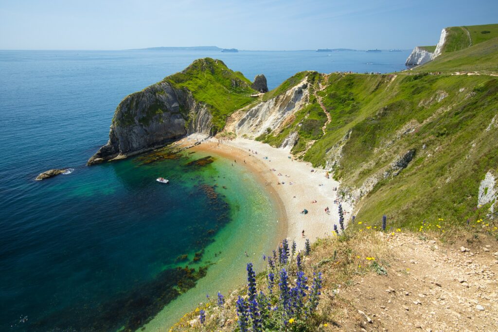 A boat moored off Lulworth Cove on a summers day
