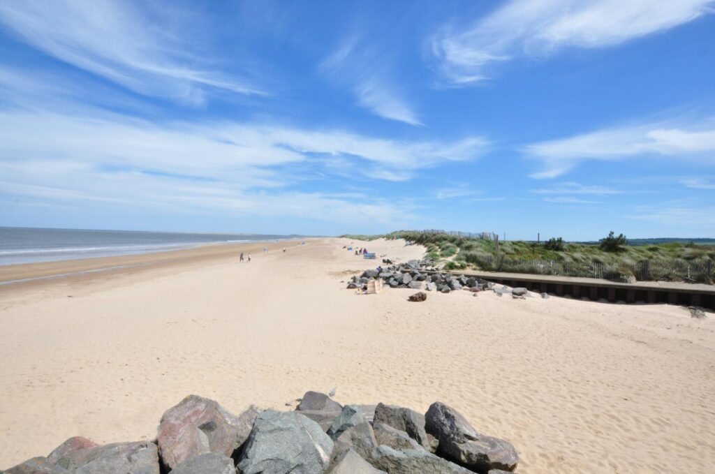 Long sandy Brancaster beach on Norfolk Coast