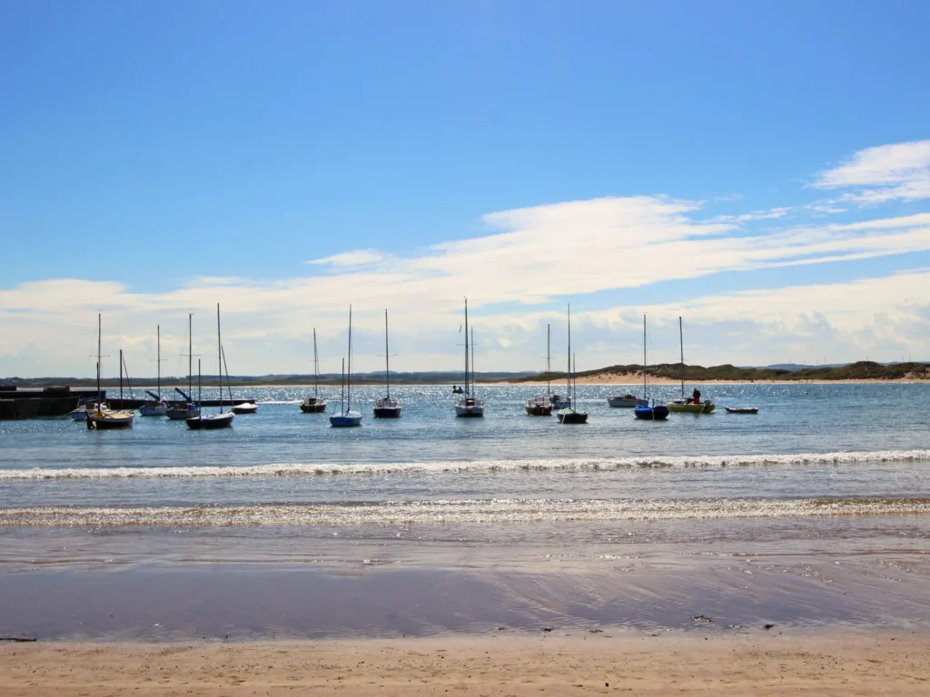 Boats moored on Seahouses beach