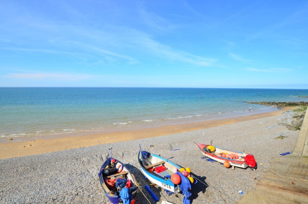 Colourful boats on Sheringham pebble beach