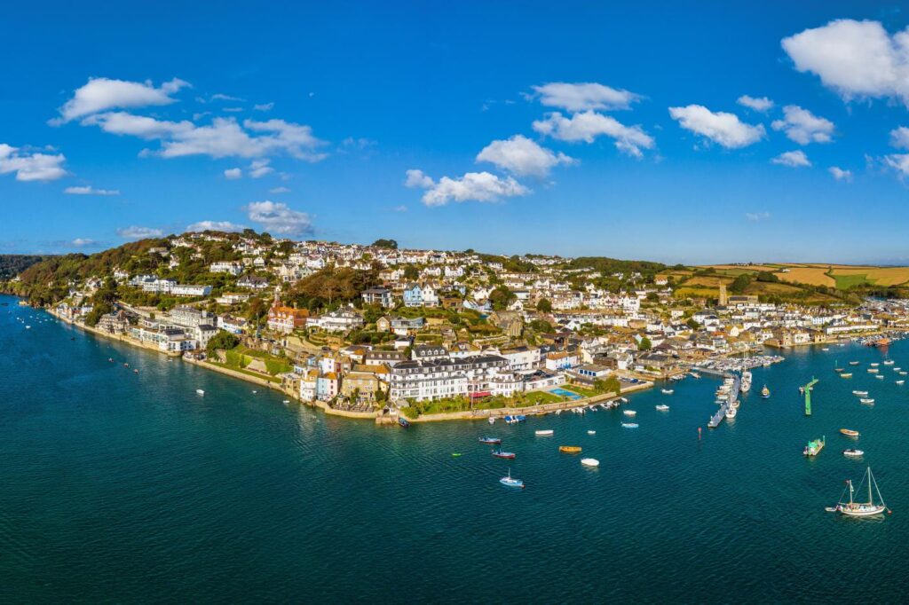Salcombe harbour with calm sea and boats bobbing