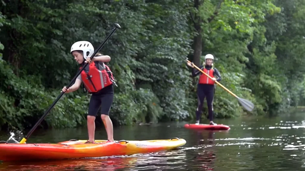 Young girl learning to SUP