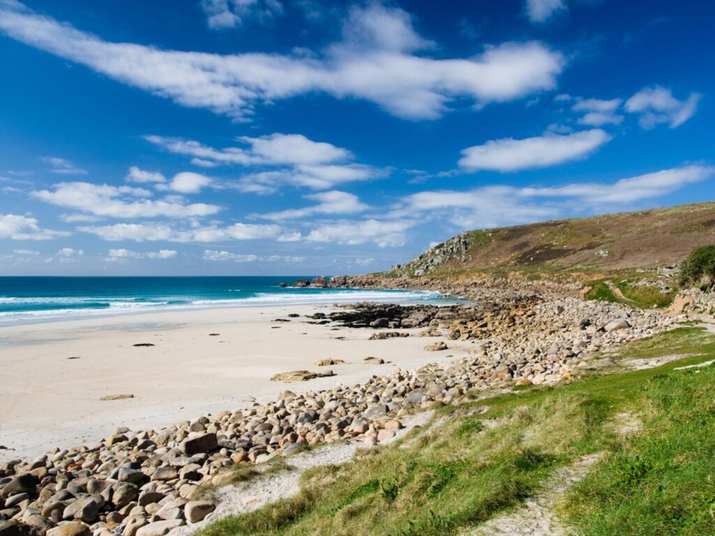 White sandy beach at Sennen Cove in Cornwall on a sunny day