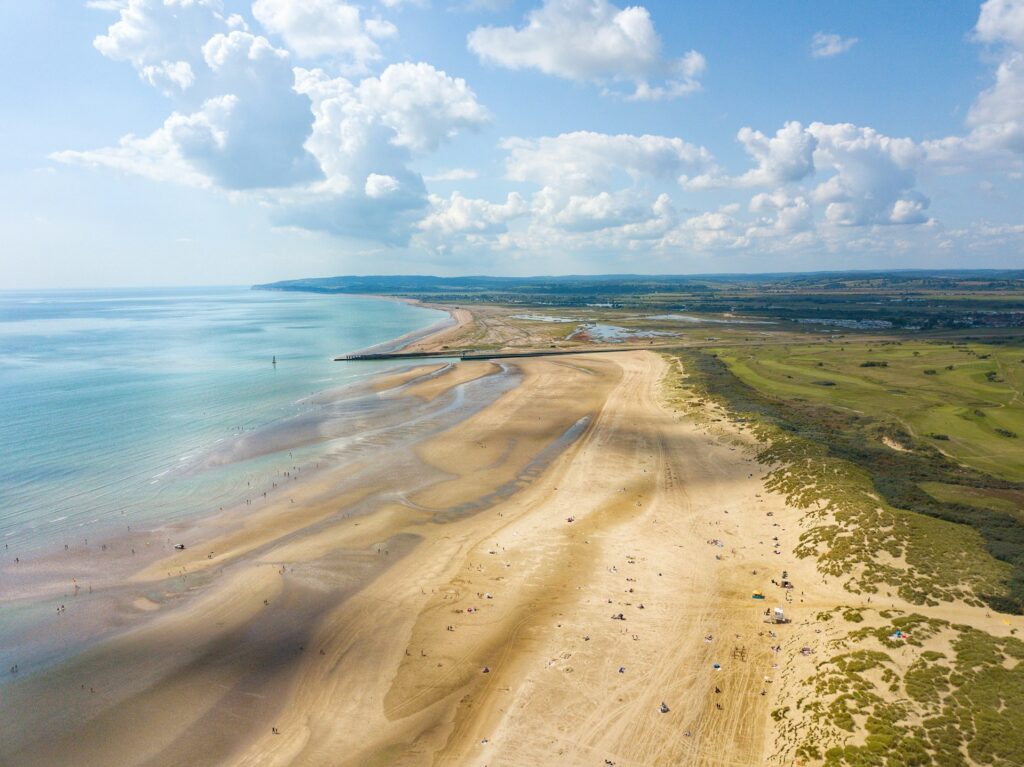 Cambers Sands beach in East Sussex on a cloudy summer's day