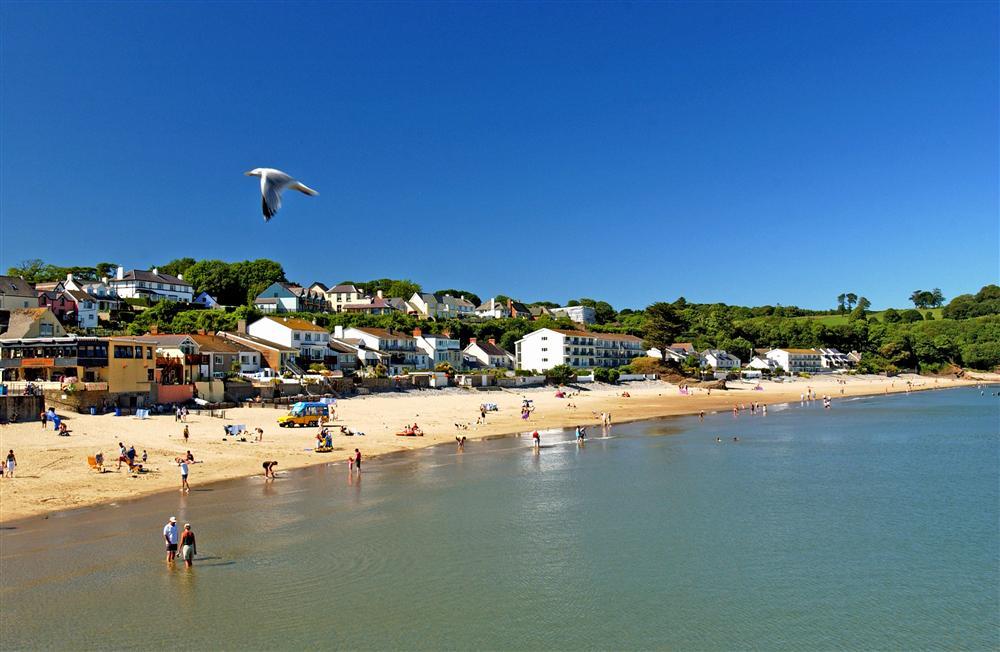Families and couples enjoying a summer's day on Saundersfoot Beach in Pembrokeshire